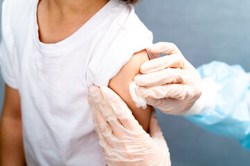 Doctor vaccinating child. Coronavirus vaccination. Covid-19 vaccine at clinic. Little boy getting...