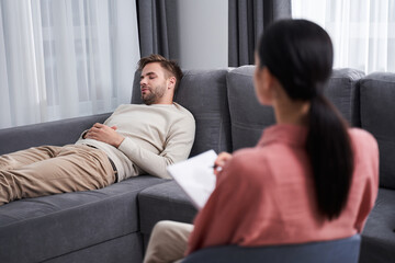 Man telling psychotherapist about problems