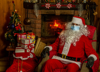 Santa claus sitting with the protective mask.
