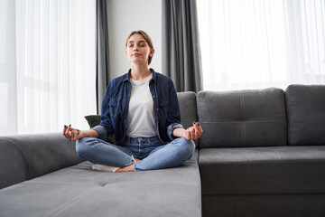 Woman meditating at home