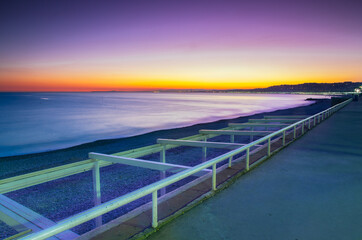 Nightview scenic of the coastline of nice with a beautiful twilight with pink tone