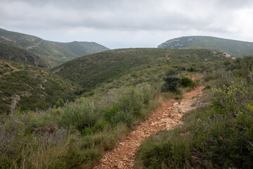 Fototapeta na wymiar Mountain landscape of the Sierra de Irta in late summer. Hiking trails for walking