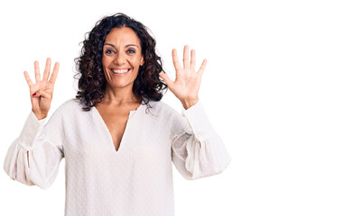 Middle age beautiful woman wearing casual sweater showing and pointing up with fingers number nine...