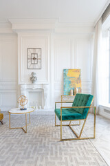 modern and very stylish interior design of large studio apartment with fashionable furniture with gold elements. very light and bright room with big windows