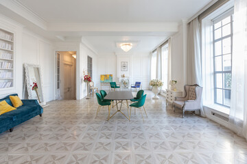 modern and very stylish interior design of large studio apartment with fashionable furniture with...