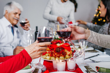 Mexican family make a toast on Christmas eve dinner