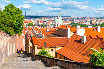 Obraz premium Castle Stairs of Prague Castle leads down to Lesser Town with Saint Nicholas church, Praha, Czech Republic