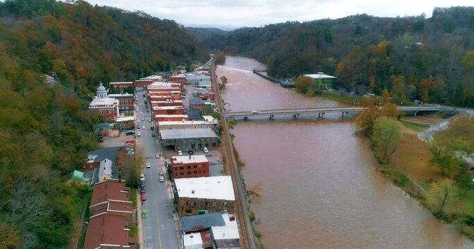 Aerial drone shot of downtown Marshall, NC along the French Broad River in the Appalachian Mountains