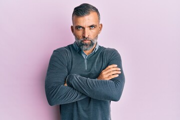 Middle age handsome man wearing casual clothes skeptic and nervous, disapproving expression on face...