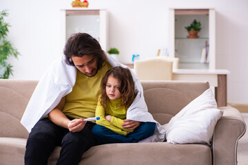 Small girl looking after her sick father