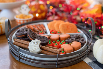 Halloween mummy cookie on a tray of sweets