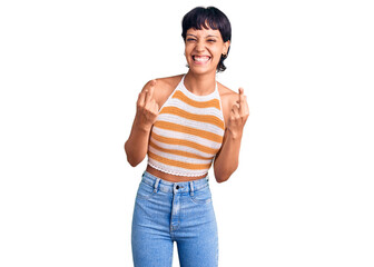 Young brunette woman with short hair wearing casual clothes showing middle finger doing fuck you...