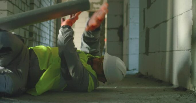 Contractor saving colleague from accident during work