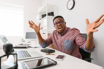 Stressed technician repairing PC in service center