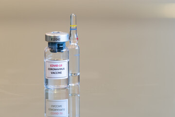 A closeup vial of COVID-19 Coronvavirus vaccine drug culture - 080