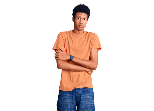 Young african american man wearing casual clothes shaking and freezing for winter cold with sad and shock expression on face