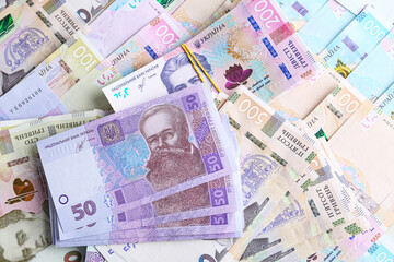Ukrainian money as background, top view. National currency
