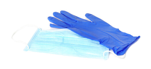 Medical glove and protective face mask on white background
