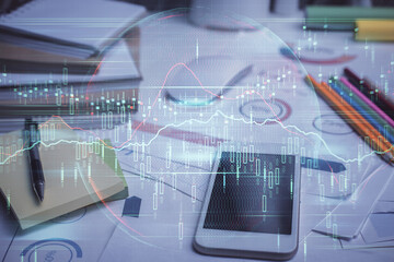 Double exposure of forex chart drawing and cell phone background. Concept of financial data analysis