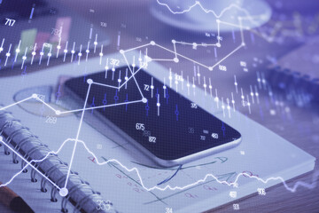 Double exposure of forex chart drawing and cell phone background. Concept of financial data analysis