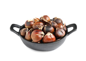 Delicious sweet roasted edible chestnuts in frying pan isolated on white
