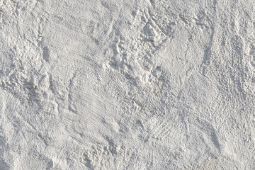 old rough plaster wall painted in white