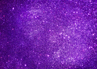 Violet abstract sparkle background reminding starry night sky. Purple glitter texture of decoration...