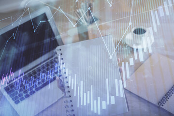 Double exposure of businesswoman hands typing on computer and forex chart hologram drawing. Financial analysis concept.