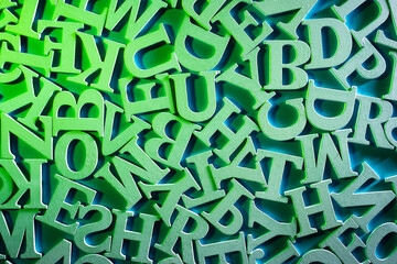 Latin volumetric letters on a plane. Top view of letters of alphabet. Alphabet as a symbol of learning english. Concept - getting education in english. Preschool education in english.