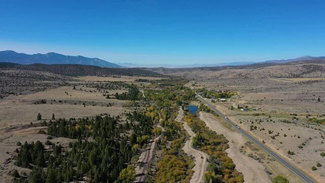 Aerial gold mines Virginia City Montana 4K. Restored wild west mining town. Restored wild west mining town. Gold mine rush now an historic site and tourism center. Restoration businesses. 