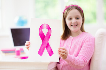 Kids drawing pink breast cancer awareness sign