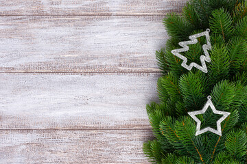 mock up, silver decorations on Christmas tree branches , new year's card, copy space.