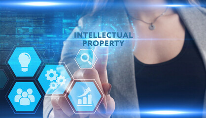 Business, Technology, Internet and network concept. Young businessman working on a virtual screen of the future and sees the inscription: Intellectual property