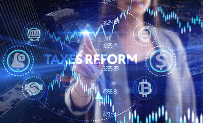 Business, Technology, Internet and network concept. Young businessman working on a virtual screen of the future and sees the inscription: Taxes reform