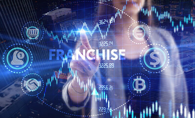 Business, Technology, Internet and network concept. Young businessman working on a virtual screen of the future and sees the inscription: Franchise