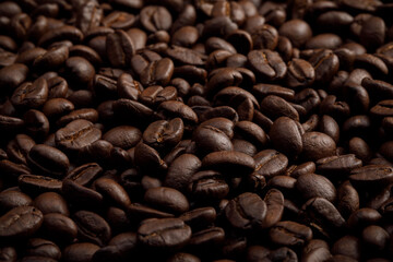 The hot of brown roasted coffee beans on brown background with copyspace, Healthy products by organic natural ingredients concept