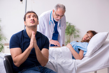 Young husband visiting sick wife in the clinic