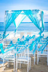 bali tropical destination beach wedding with canopy, chairs and decoration and the sea