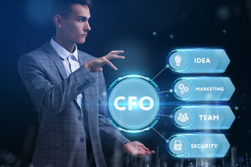 Business, Technology, Internet and network concept. Young businessman working on a virtual screen of the future and sees the inscription: CFO
