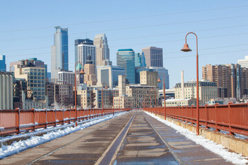 Skyline of downtown Minneapolis Minnesota from the historic Stone Arch Bridge