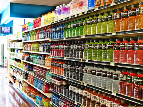 BEMIDJI, MN - 8 FEB 2019: Rows of colorful bottles of beverages stacked on shelves in a local supermarket.