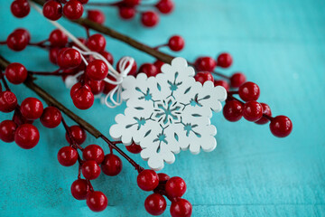 Christmas decorations red berries on a wooden background