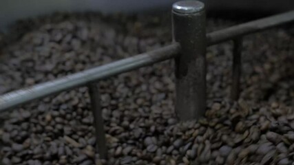 coffee roaster spinning beans fast, close up shot at Nicaraguan coffee roaster