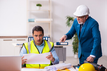 Two male architects working in the office