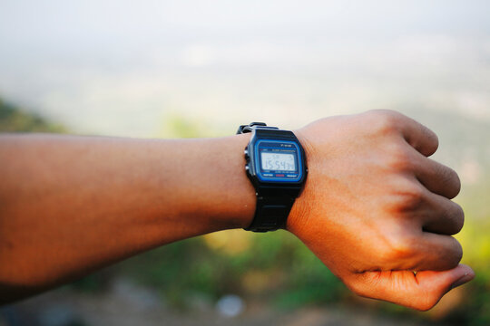 close up hand showing wristwatch 