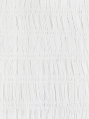 Part of white dress close up