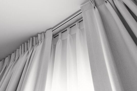 Two layers curtain with rails, installed on ceiling, translucent and  blocking lights curtain Stock Photo | Adobe Stock