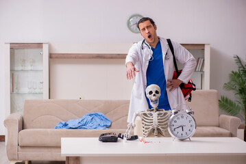 Young male paramedic visiting skeleton patient