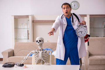 Young male paramedic visiting skeleton patient