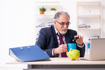 Old businessman employee in bankruptcy concept